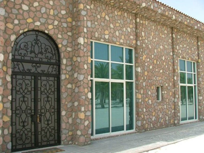 Stone façade & wrought-iron entrance